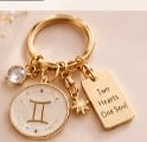 Gemini keychain with the tag Two Hearts One Soul